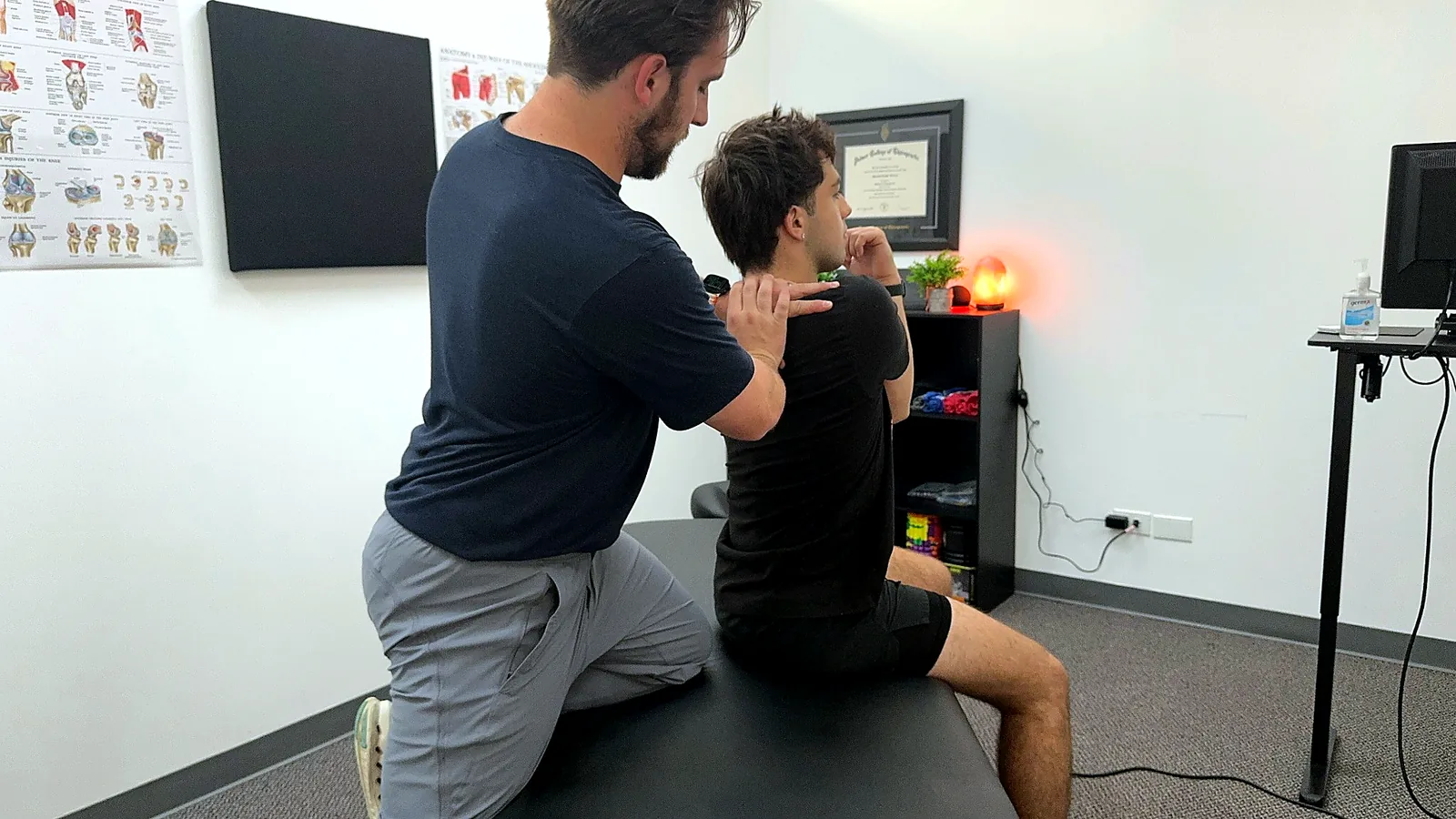 Hands-on soft tissue treatment for shoulder mobility at Elite Performance Institute in Naperville Illinois