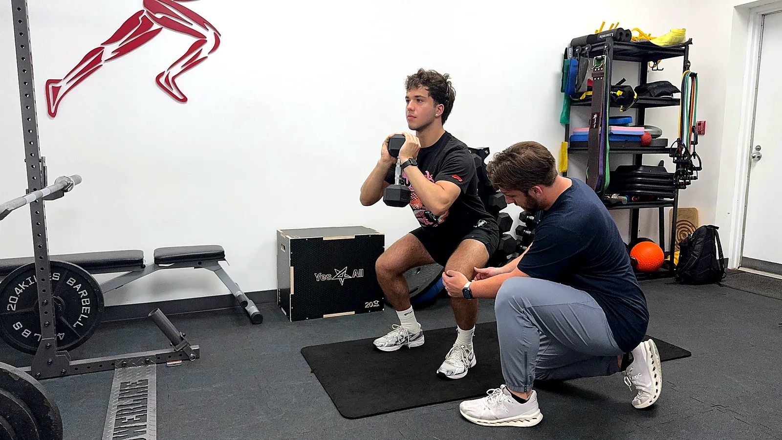 Dr. Max guiding a sports rehabilitation movement assessment at Elite Performance Institute in Naperville Illinois
