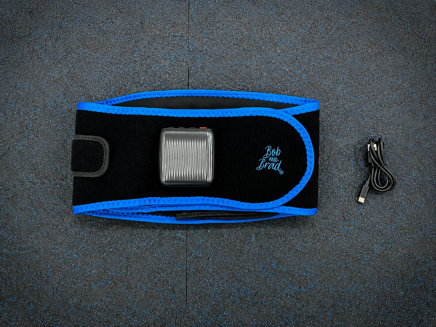Bob and Brad ThermoRed Belt and Charging Cable Bob and Brad ThermoRed Belt folded beside its USB-C charging cable