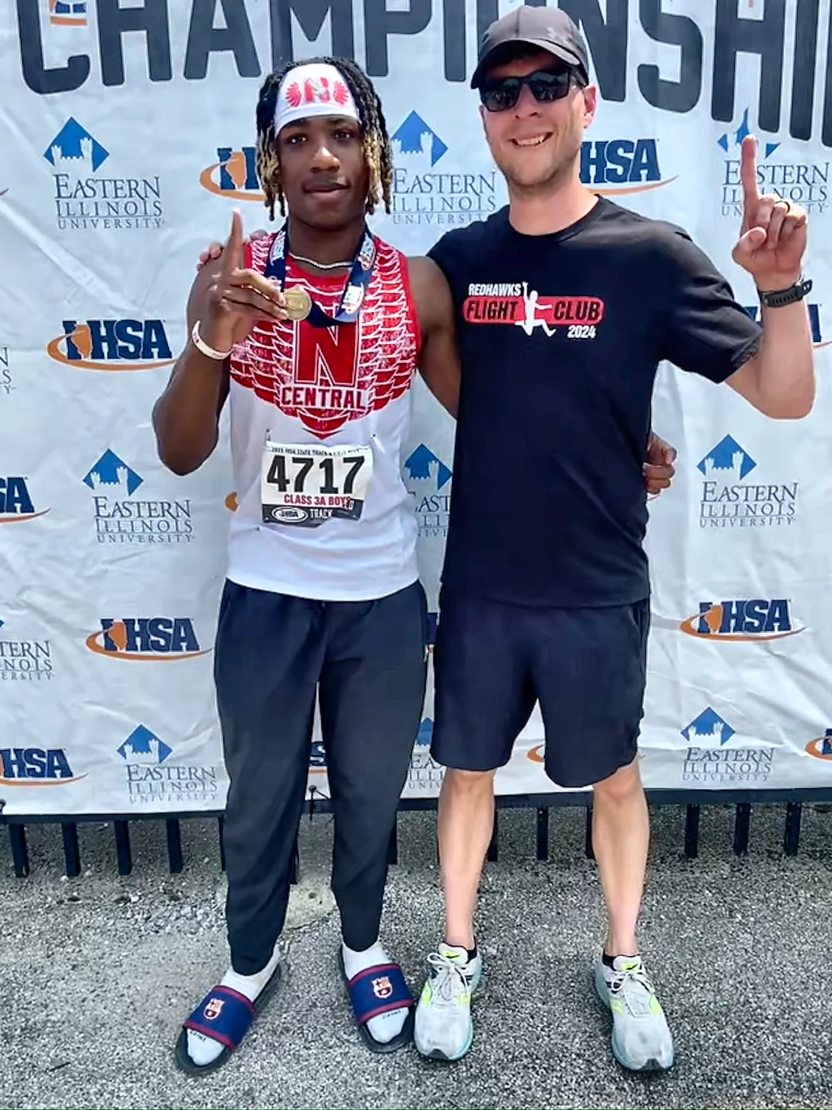 Dr Brian Damhoff with 2025 IHSA long jump champion Zoelen Terry at the state track meet